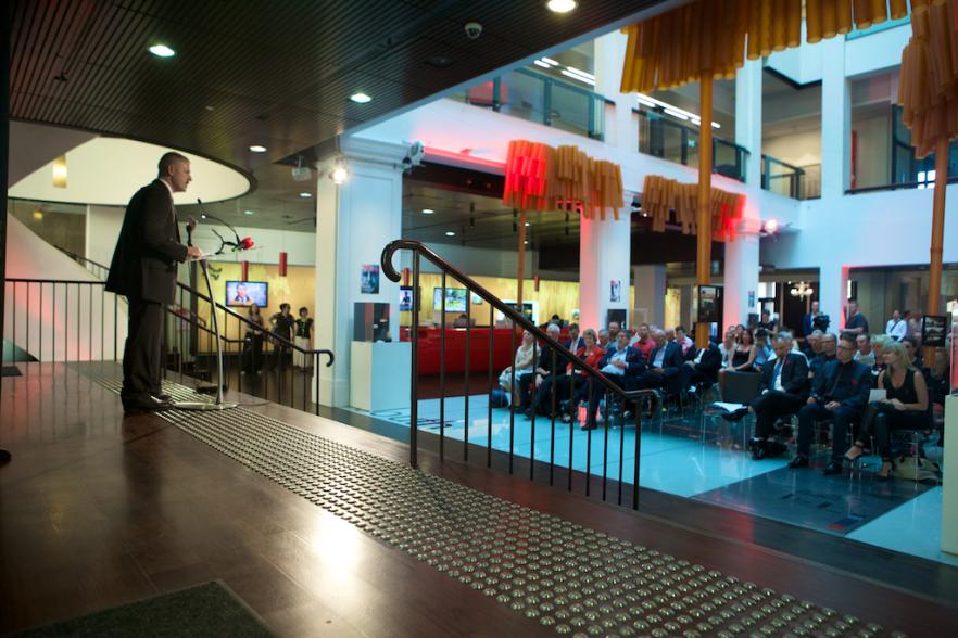 Photo of presenter and audience at World Aids Day event at Customs House in 2014