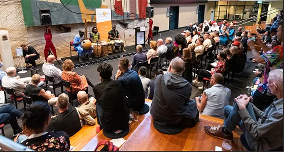 People watching performance at positive life event