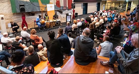 People watching performance at positive life event
