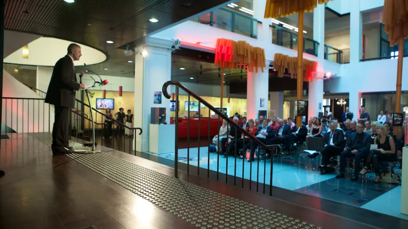 Photo of presenter and audience at World Aids Day event at Customs House in 2014