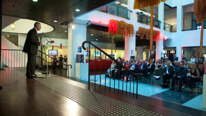 Photo of presenter and audience at World Aids Day event at Customs House in 2014